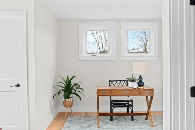 a view of a room that has a table and chair in it