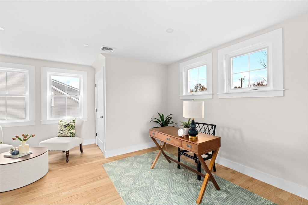 19 Ford Place, Unit 1 Scituate, MA 02066 - Photo 28 of 35 a workspace room with furniture and wooden floor