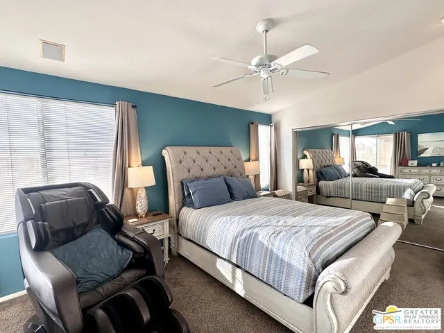 a bedroom with a bed and a couch