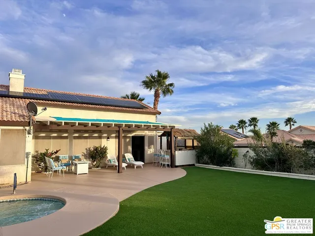 a view of a porch and garden