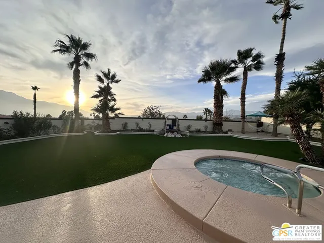 a view of a fountain in front of a lake