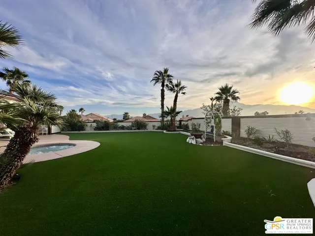 a view of a golf course with a lake view