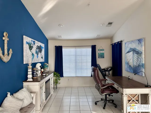 a workspace with furniture and window