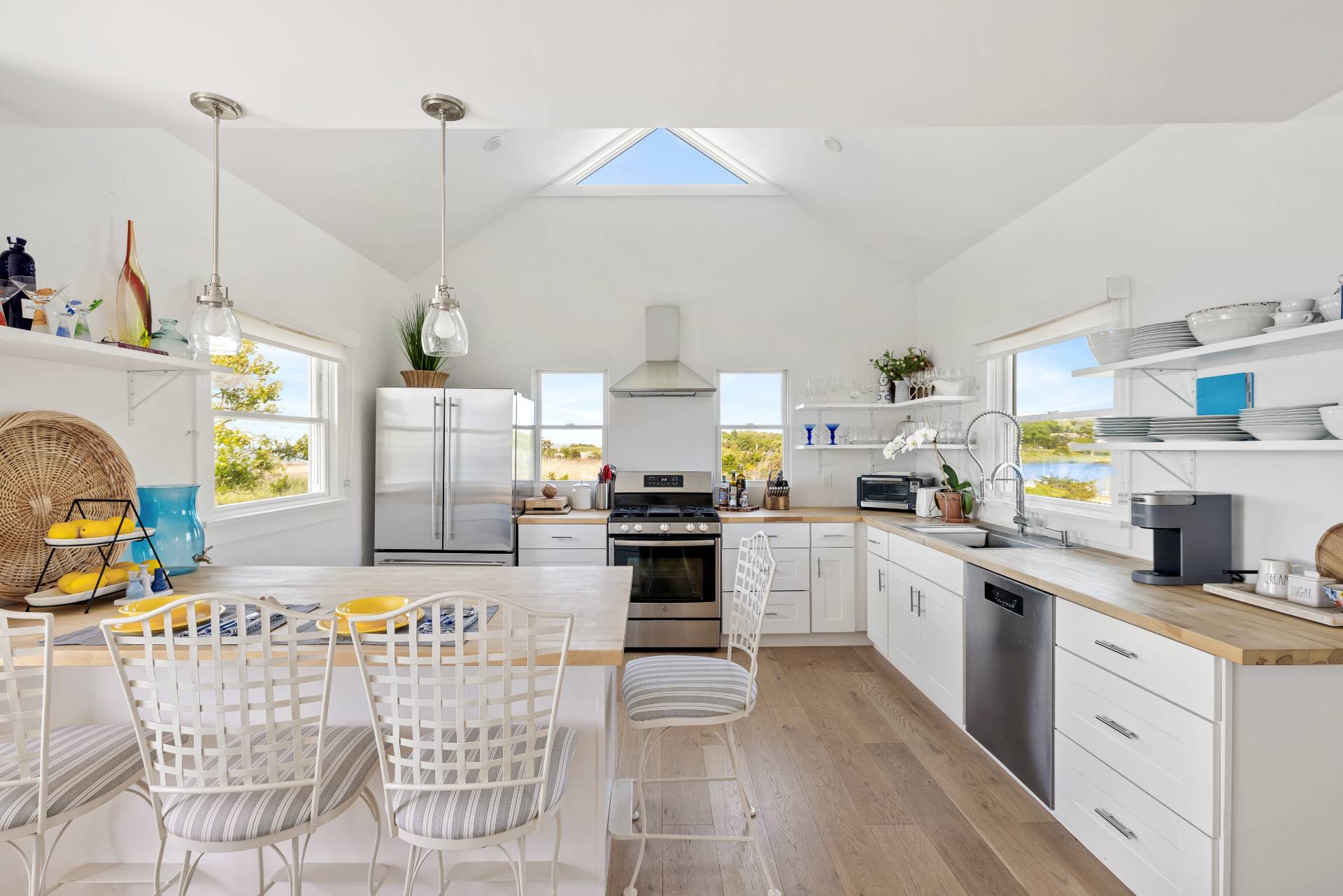 48 Bay Inlet Road East Hampton, NY 11937 - Photo 13 of 46 a kitchen with stainless steel appliances kitchen island granite countertop a stove and white cabinets