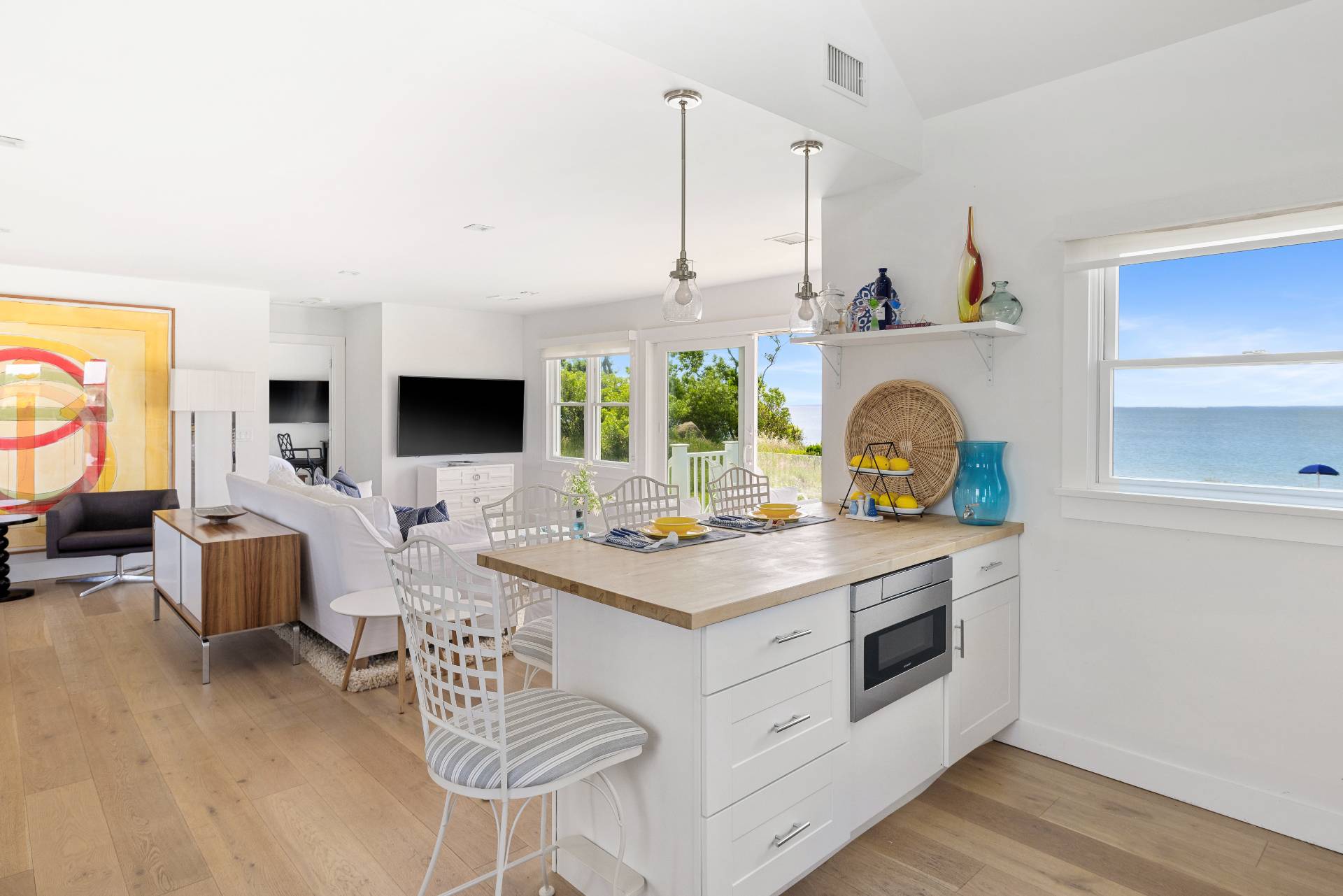 48 Bay Inlet Road East Hampton, NY 11937 - Photo 15 of 46 a kitchen with a stove and a white wooden cabinets