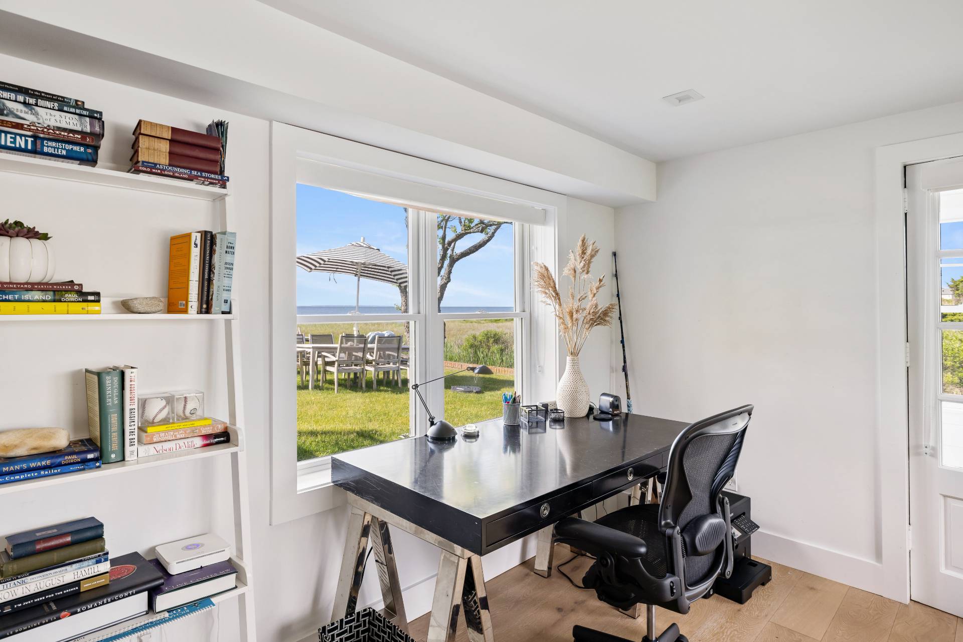 48 Bay Inlet Road East Hampton, NY 11937 - Photo 23 of 46 a view of a workspace with furniture and a window