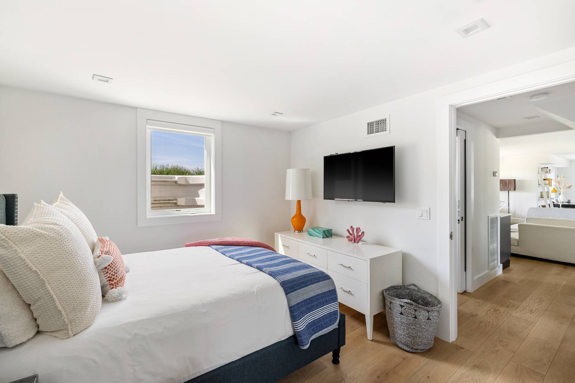 48 Bay Inlet Road East Hampton, NY 11937 - Photo 24 of 46 a bedroom with a bed and a flat screen tv