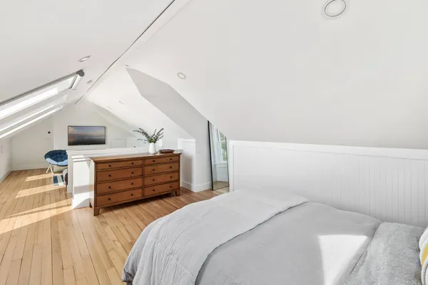 a bedroom with a bed and cabinets