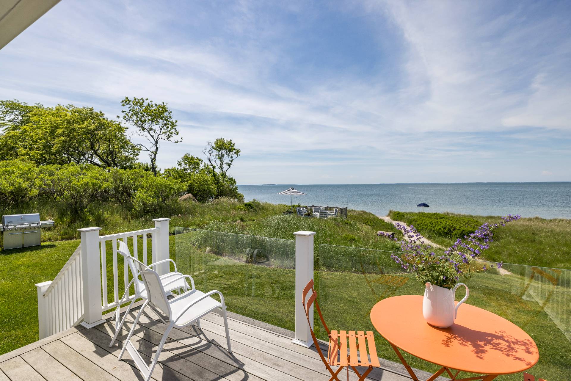 48 Bay Inlet Road East Hampton, NY 11937 - Photo 31 of 46 a view of a balcony with chairs