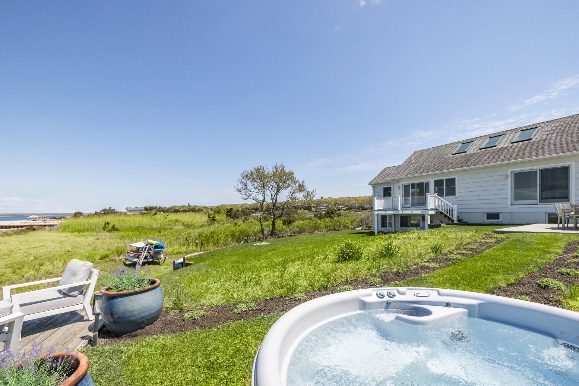 48 Bay Inlet Road East Hampton, NY 11937 - Photo 34 of 46 a view of a patio with furniture and garden
