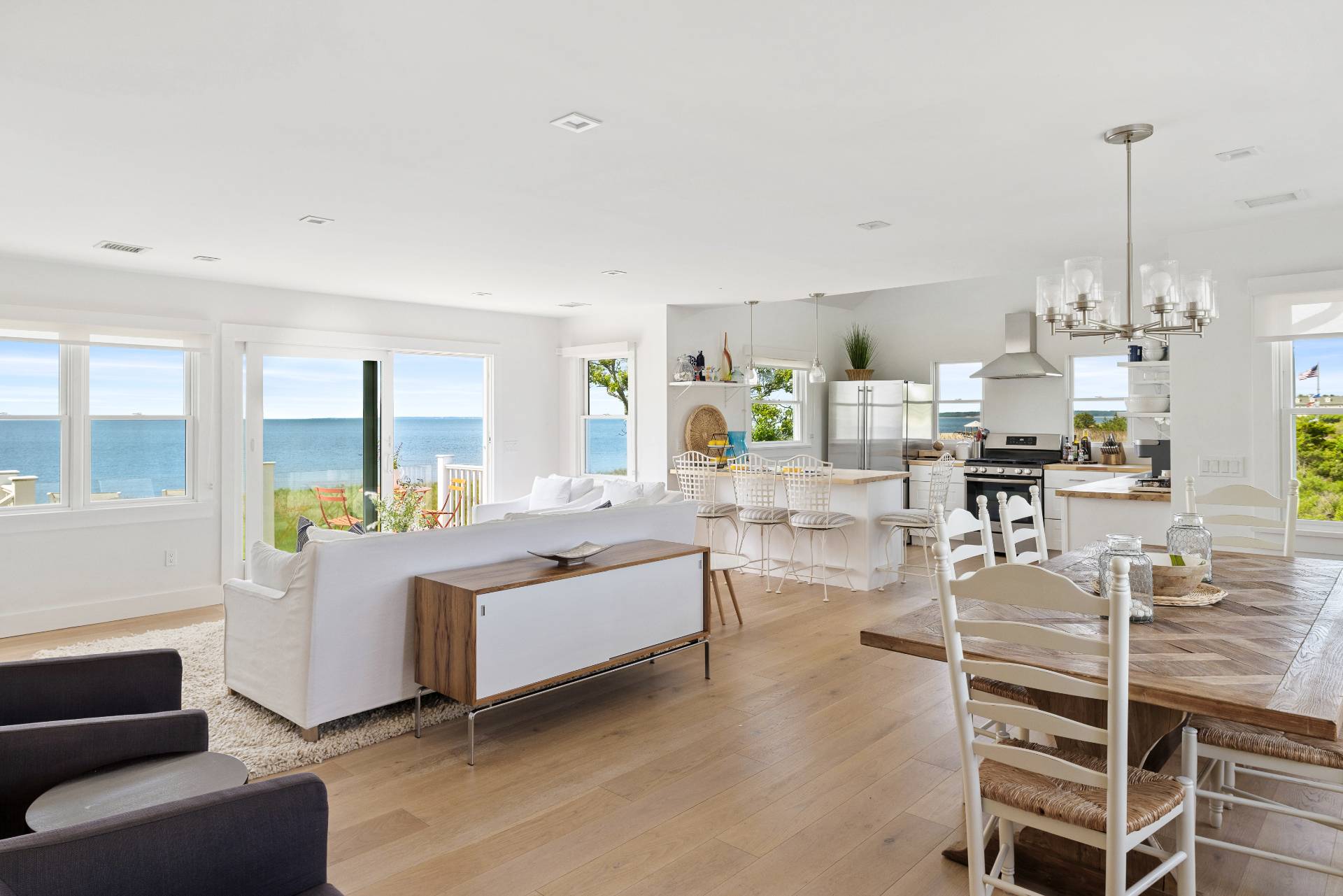 48 Bay Inlet Road East Hampton, NY 11937 - Photo 4 of 46 a living room with furniture and a chandelier