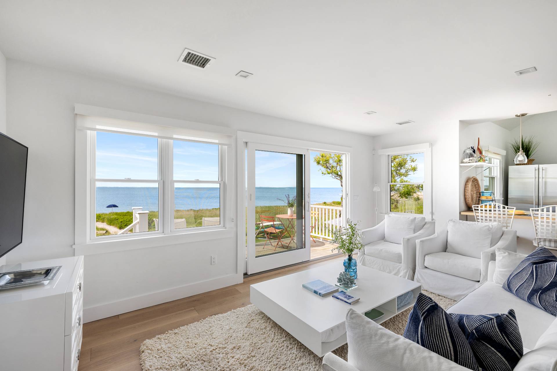 48 Bay Inlet Road East Hampton, NY 11937 - Photo 5 of 46 a living room with furniture and a flat screen tv