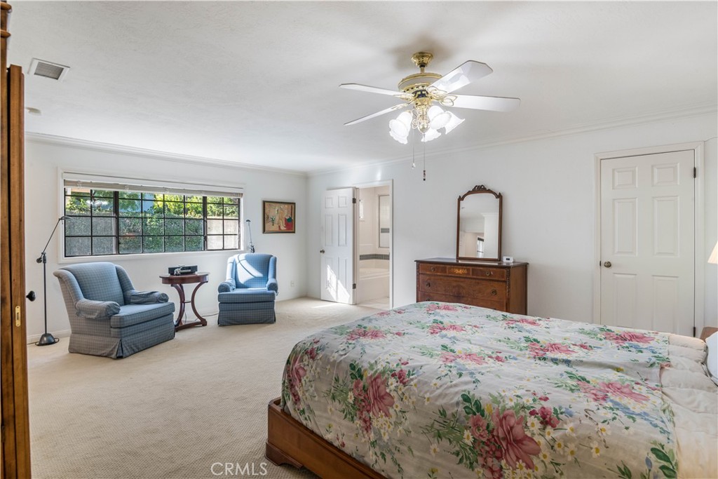 63 Ranchview Road Rolling Hills Estates, CA 90274 - Photo 16 of 28 a bedroom with a large bed and a chandelier