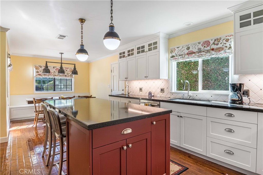 63 Ranchview Road Rolling Hills Estates, CA 90274 - Photo 4 of 28 a kitchen with stainless steel appliances granite countertop a sink a stove and a wooden floors