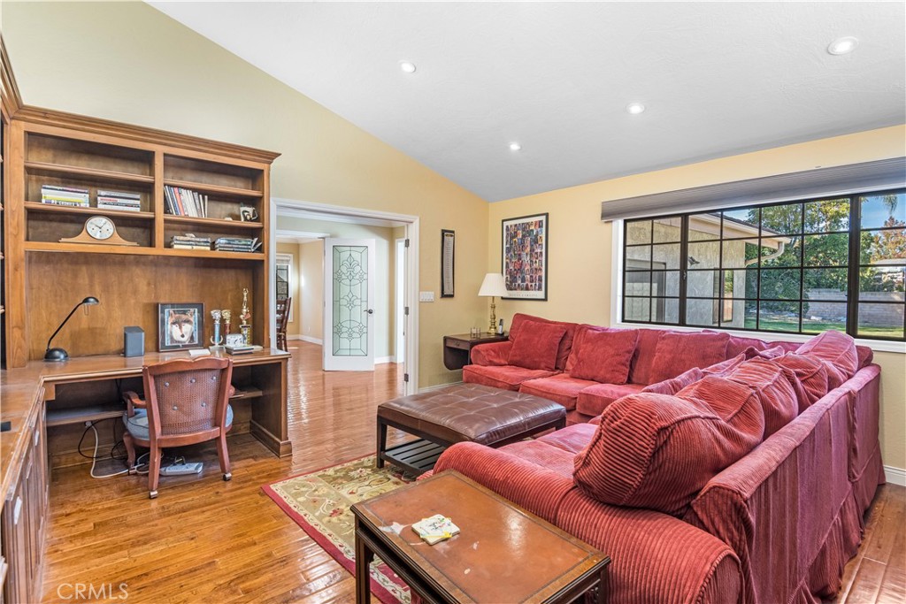 63 Ranchview Road Rolling Hills Estates, CA 90274 - Photo 10 of 28 a living room with furniture a bookshelf and a window