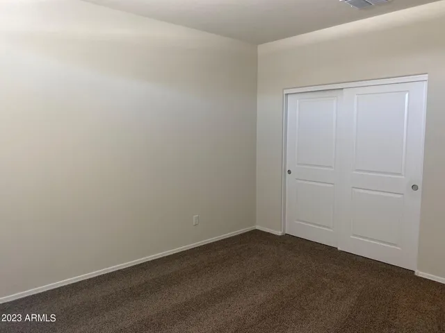 an empty room with a bench