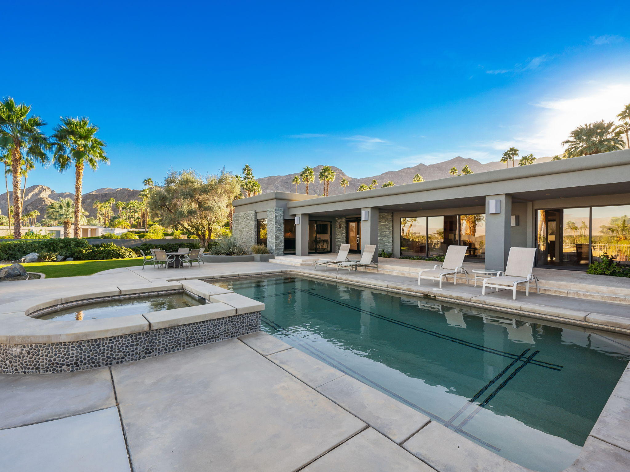 70291 Pecos Road Rancho Mirage, CA 92270 - Photo 14 of 65 a view of house with outdoor space and swimming pool