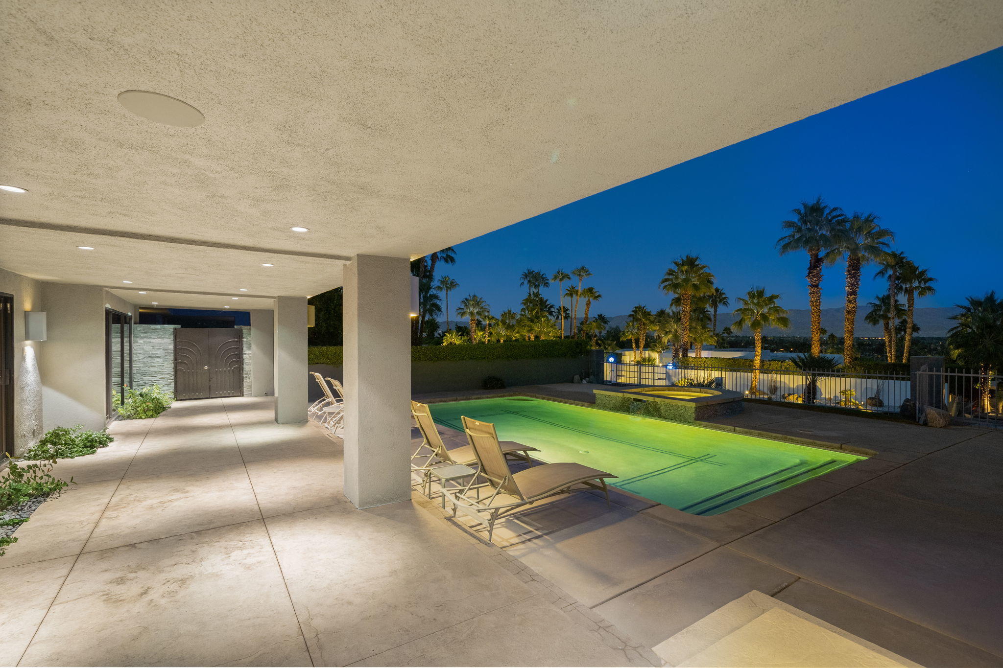70291 Pecos Road Rancho Mirage, CA 92270 - Photo 4 of 65 a view of a house with backyard porch and garden