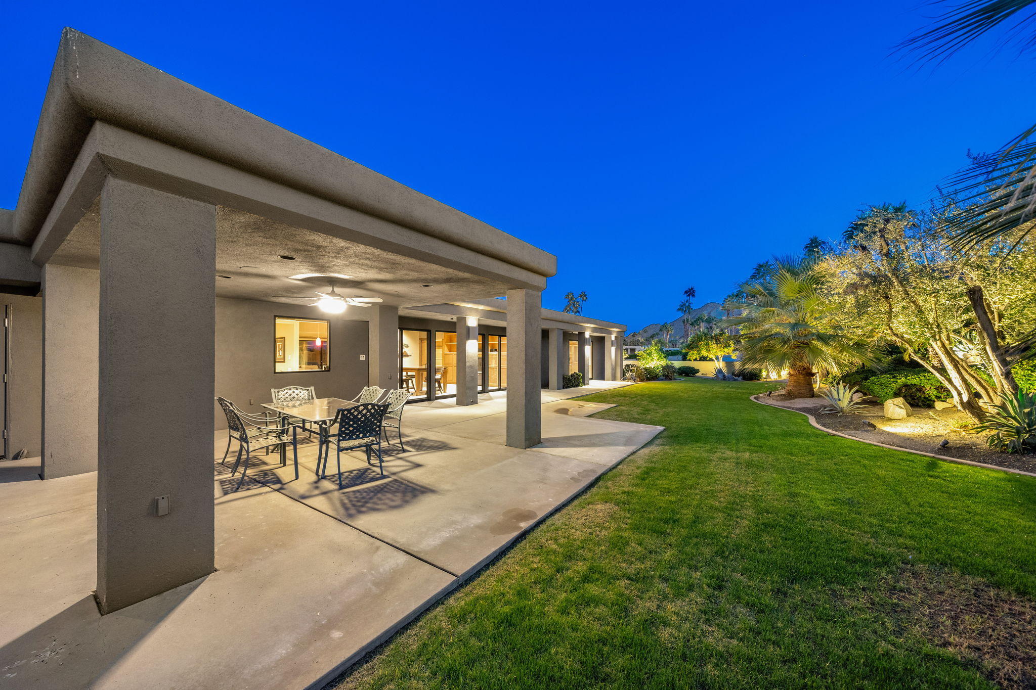 70291 Pecos Road Rancho Mirage, CA 92270 - Photo 5 of 65 a view of a patio with table and chairs and floor to ceiling window