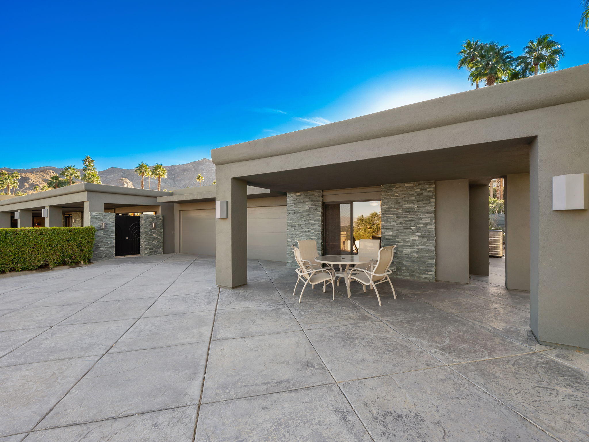 70291 Pecos Road Rancho Mirage, CA 92270 - Photo 9 of 65 a view of a patio with table and chairs and potted plants