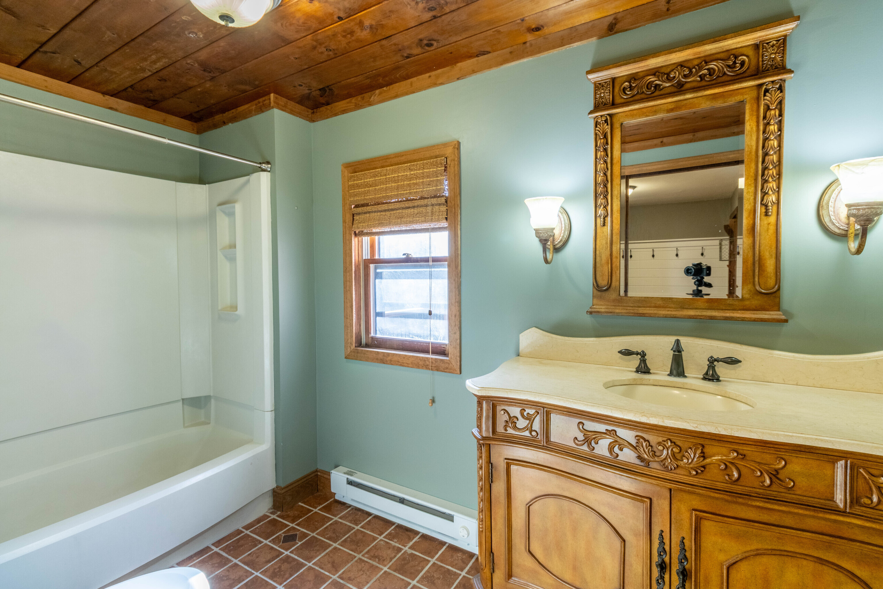 67 Moodus Leesville Road East Haddam, CT 06469 - Photo 18 of 38 a bathroom with a sink a mirror and a bathtub