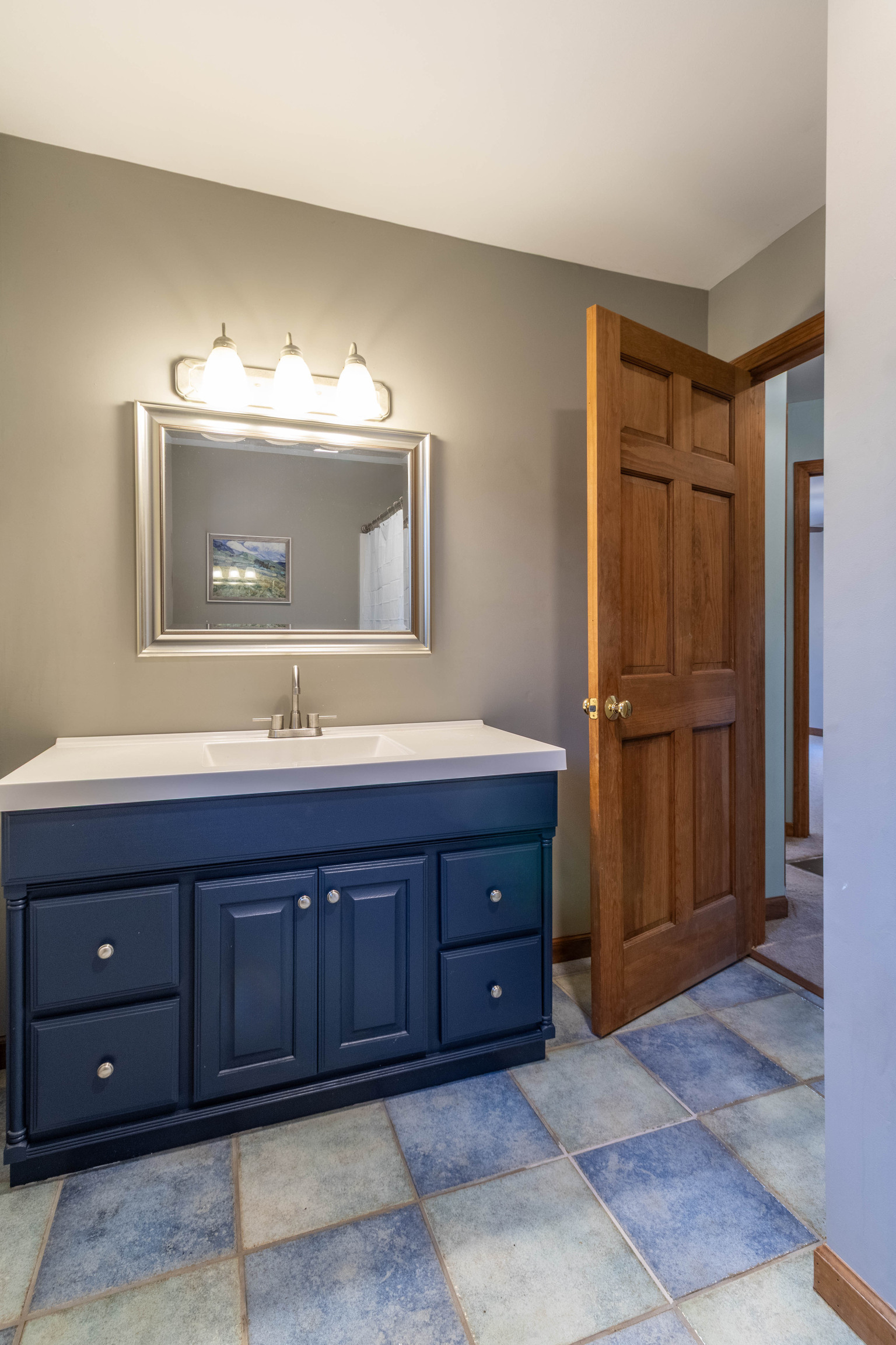 67 Moodus Leesville Road East Haddam, CT 06469 - Photo 28 of 38 a bathroom with a double vanity sink and a mirror