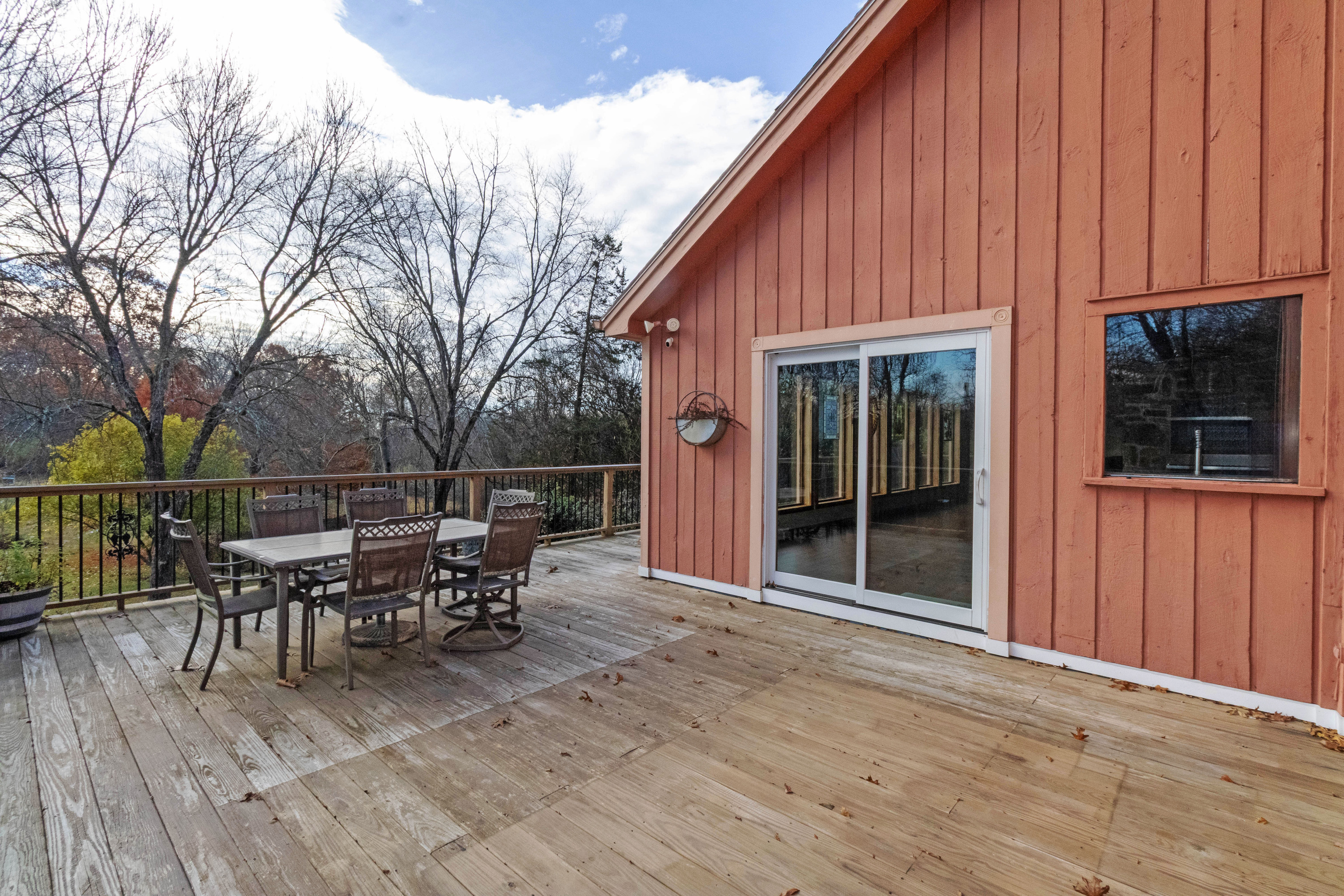 67 Moodus Leesville Road East Haddam, CT 06469 - Photo 30 of 38 a view of a patio with table and chairs with wooden floor and fence