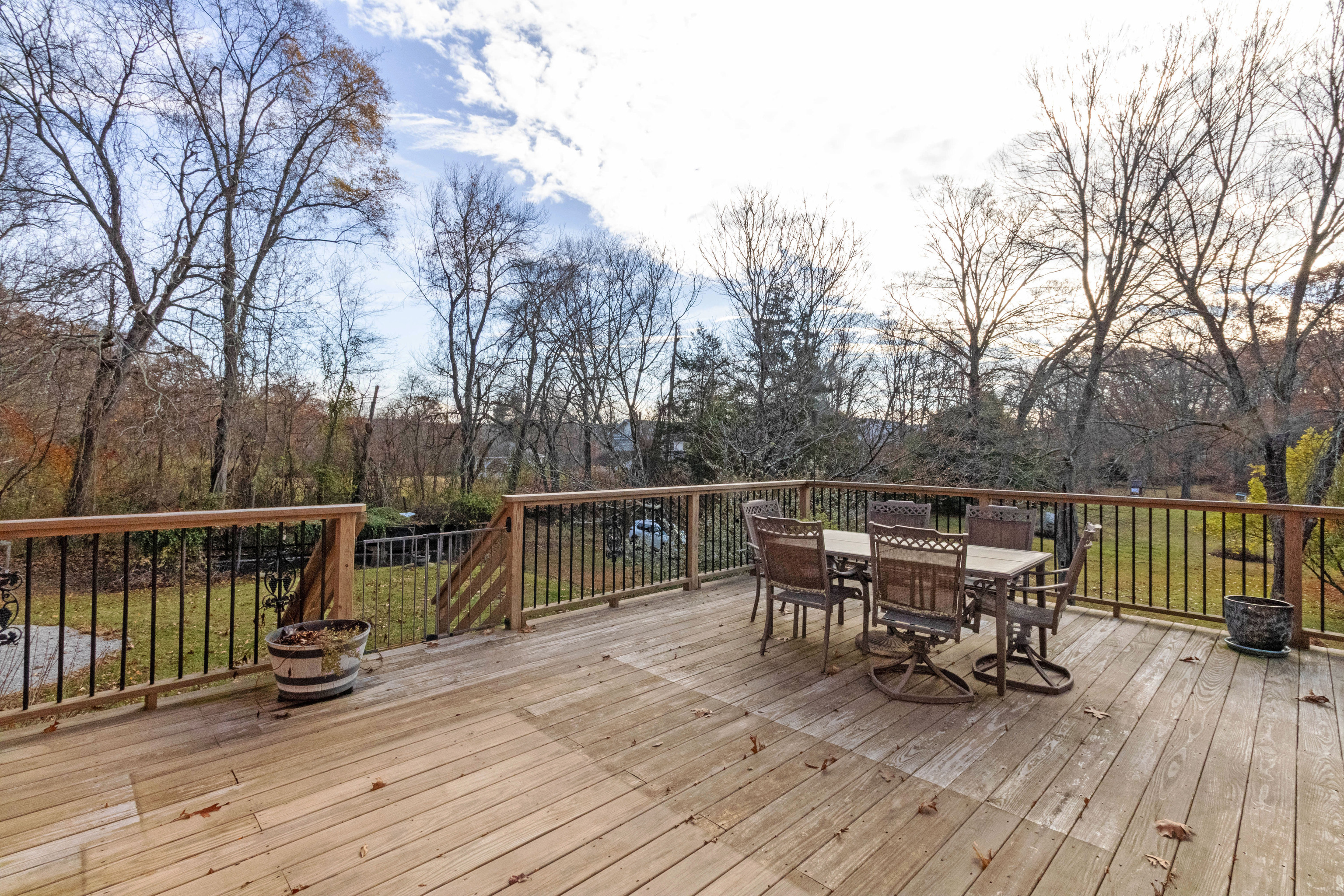 67 Moodus Leesville Road East Haddam, CT 06469 - Photo 32 of 38 a view of a roof deck with table and chairs wooden floor and fence