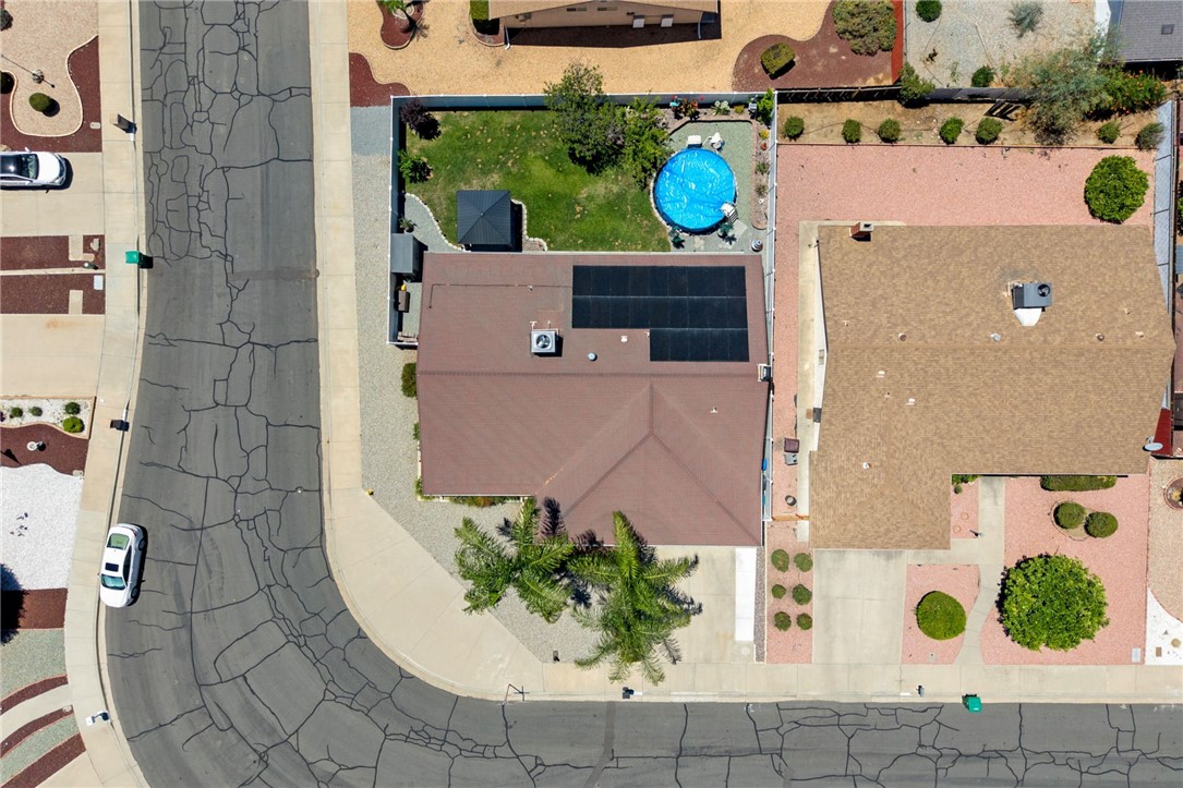 27879 Foxfire Street Menifee, CA 92586 - Photo 5 of 36 an aerial view of a house with a yard and large trees