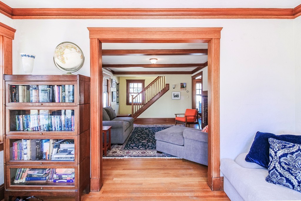 20 Stoneleigh Road, Unit 20 Newton, MA 02465 - Photo 11 of 30 a living room with furniture and a book shelf