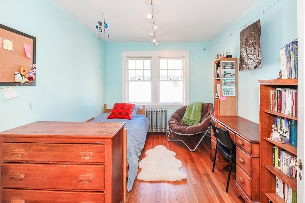20 Stoneleigh Road, Unit 20 Newton, MA 02465 - Photo 12 of 30 a room with a bed and furniture