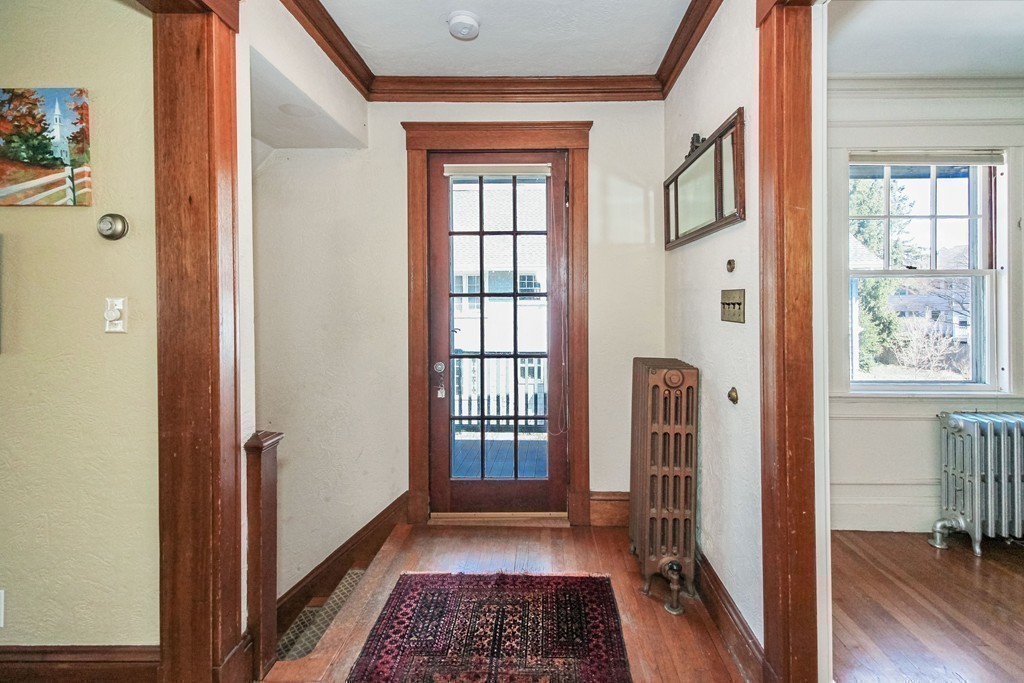 20 Stoneleigh Road, Unit 20 Newton, MA 02465 - Photo 20 of 30 a view of hallway with wooden floor and a window