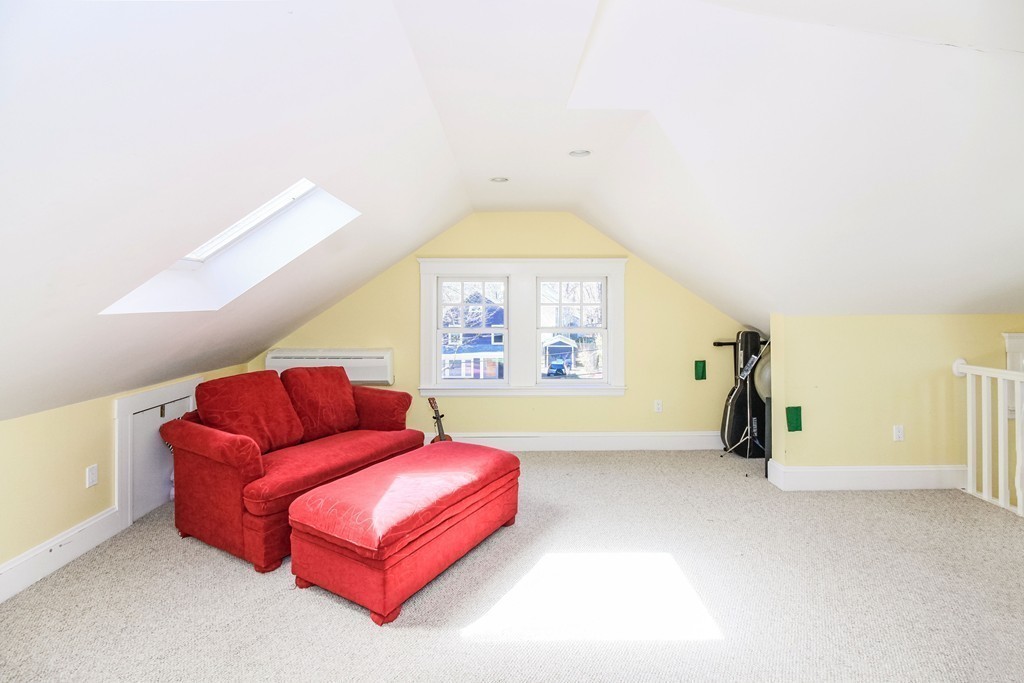 20 Stoneleigh Road, Unit 20 Newton, MA 02465 - Photo 21 of 30 a living room with furniture and a large window