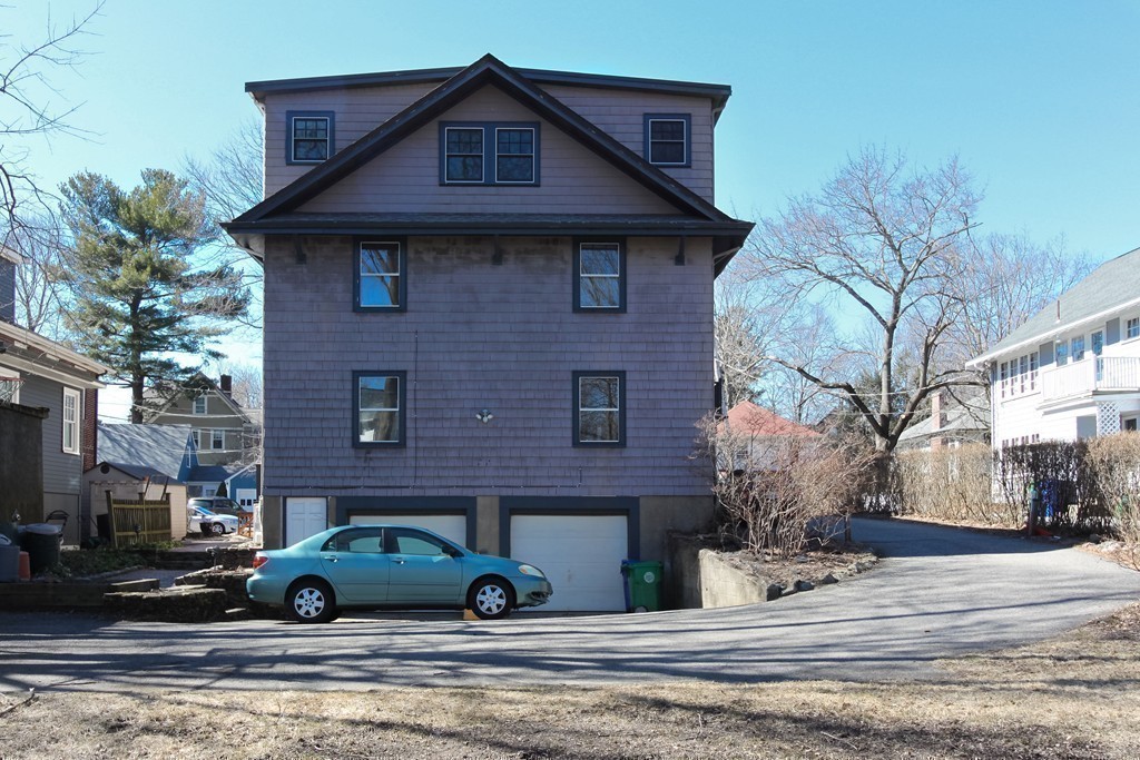 20 Stoneleigh Road, Unit 20 Newton, MA 02465 - Photo 27 of 30 a front view of a house with parking space