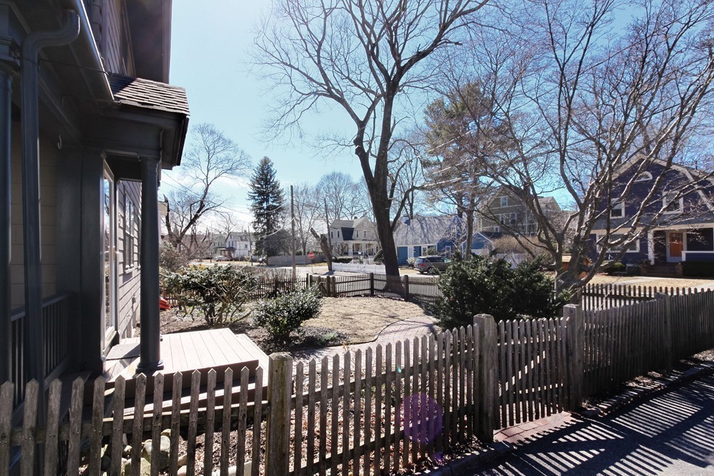 20 Stoneleigh Road, Unit 20 Newton, MA 02465 - Photo 29 of 30 a view of a house with a wooden fence
