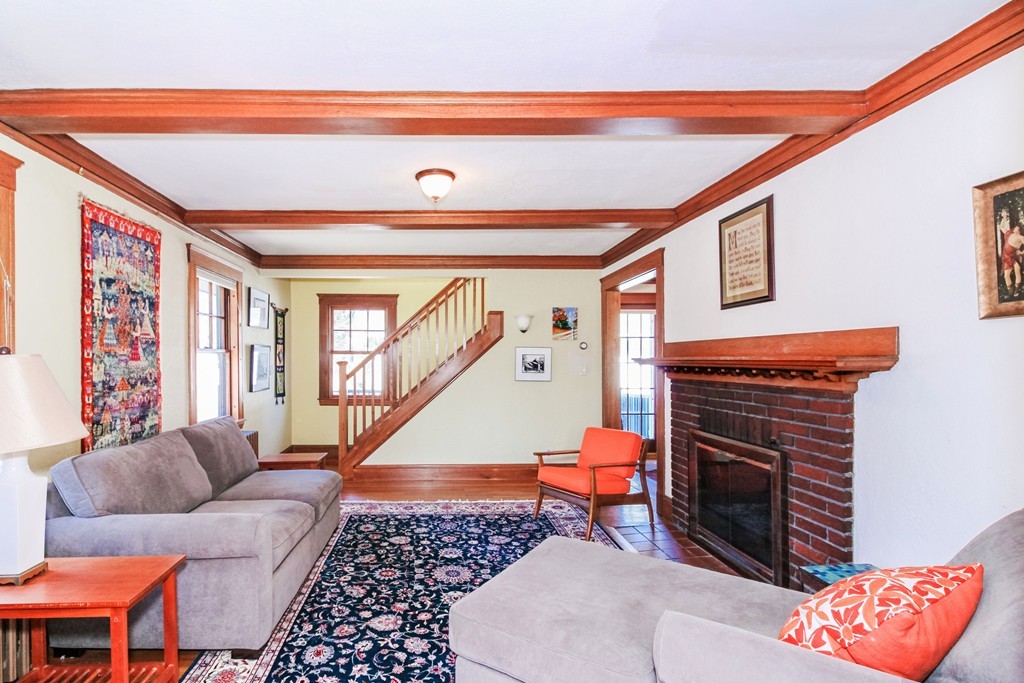 20 Stoneleigh Road, Unit 20 Newton, MA 02465 - Photo 8 of 30 a living room with furniture a rug and a window
