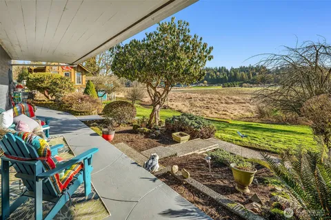 a view of a dining room with furniture wooden floor and a chandelier