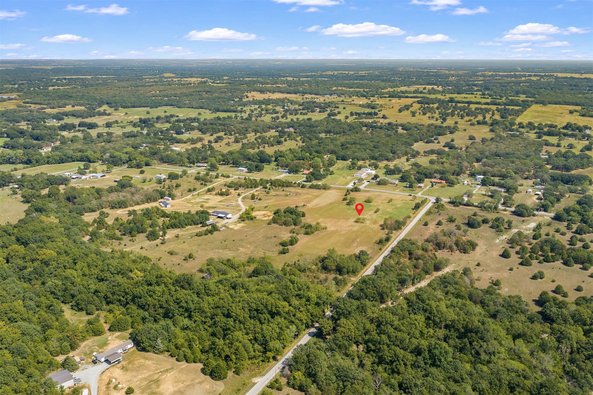 162 Big Bear Road Lone Grove, OK 73443 - Photo 6 of 12 Expansive acreage with a mix of woodlands and open fields