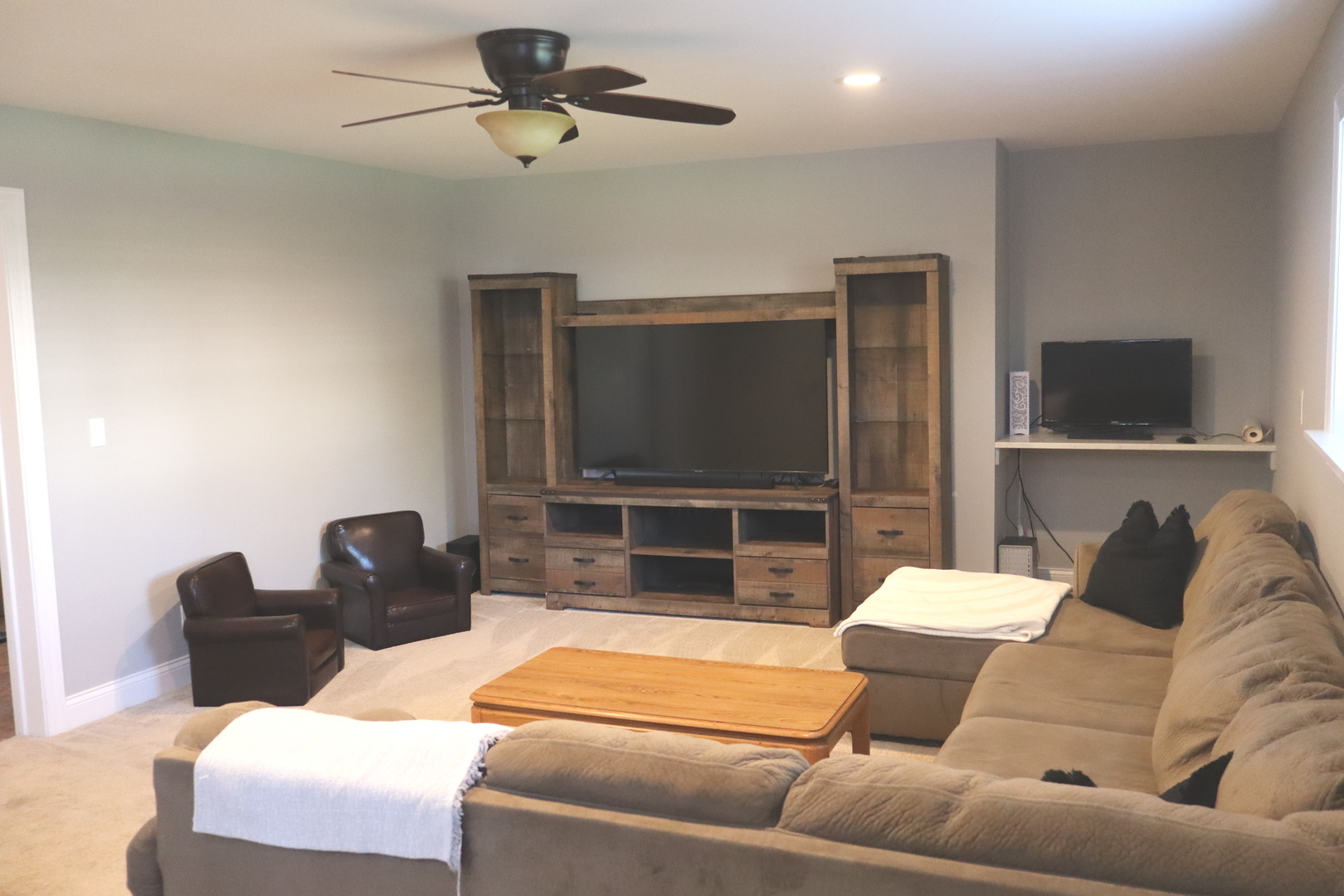 24930 Cashel Bay Road Manhattan, IL 60442 - Photo 12 of 24 a living room with furniture and a flat screen tv