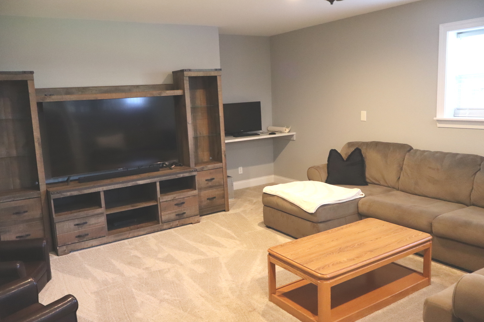 24930 Cashel Bay Road Manhattan, IL 60442 - Photo 13 of 24 a living room with furniture and a flat screen tv