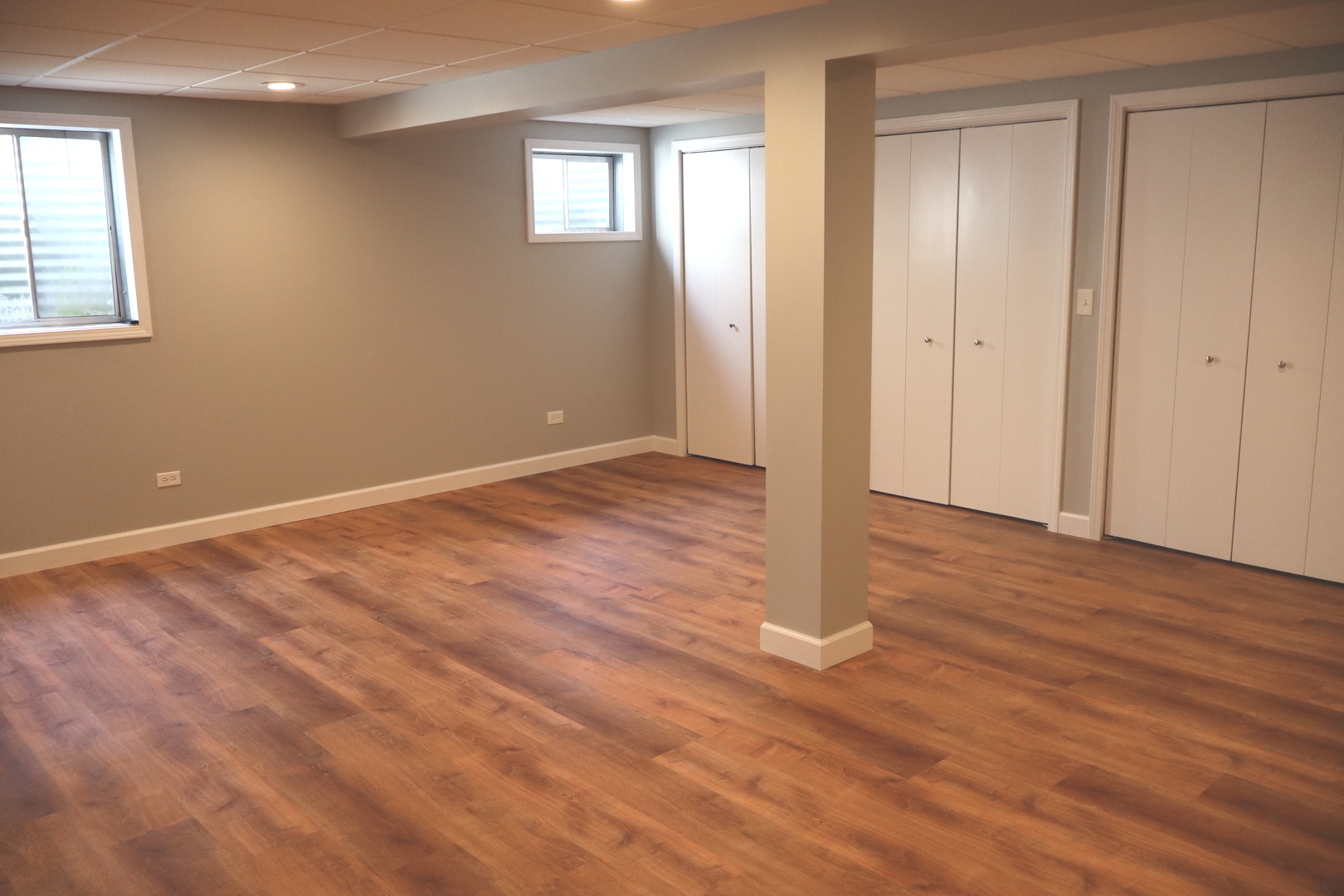 24930 Cashel Bay Road Manhattan, IL 60442 - Photo 14 of 24 a view of an empty room with wooden floor and a window