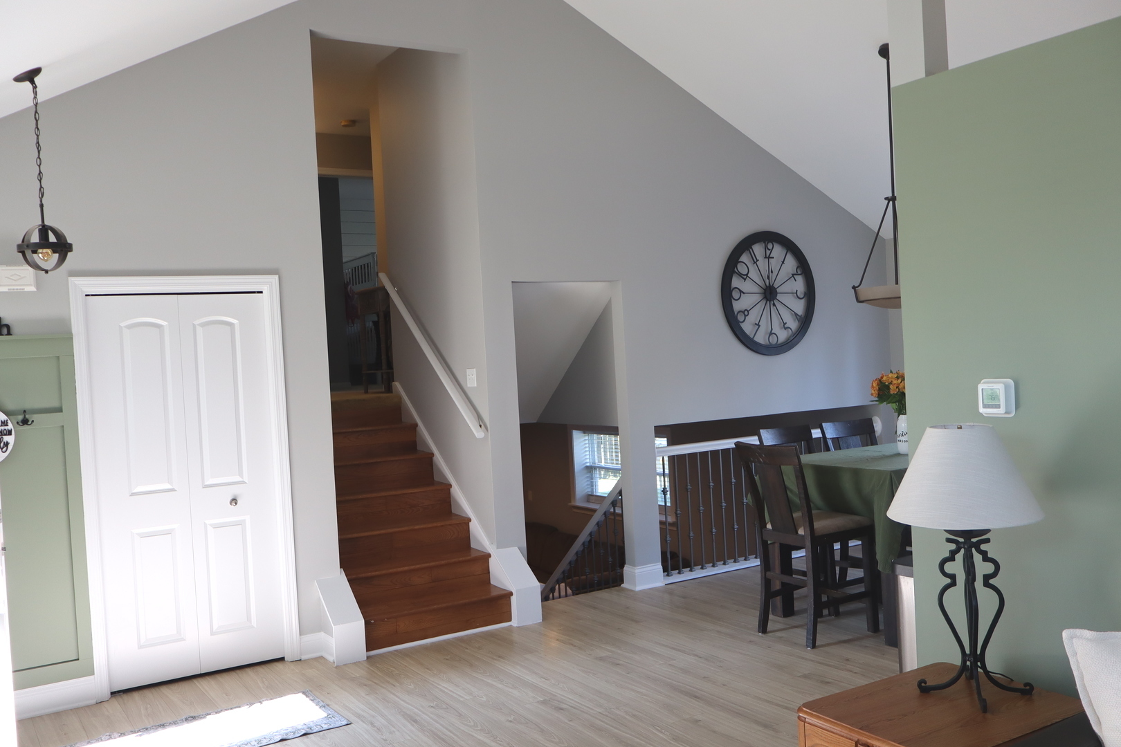 24930 Cashel Bay Road Manhattan, IL 60442 - Photo 6 of 24 a view of a hallway with a dining table and chairs