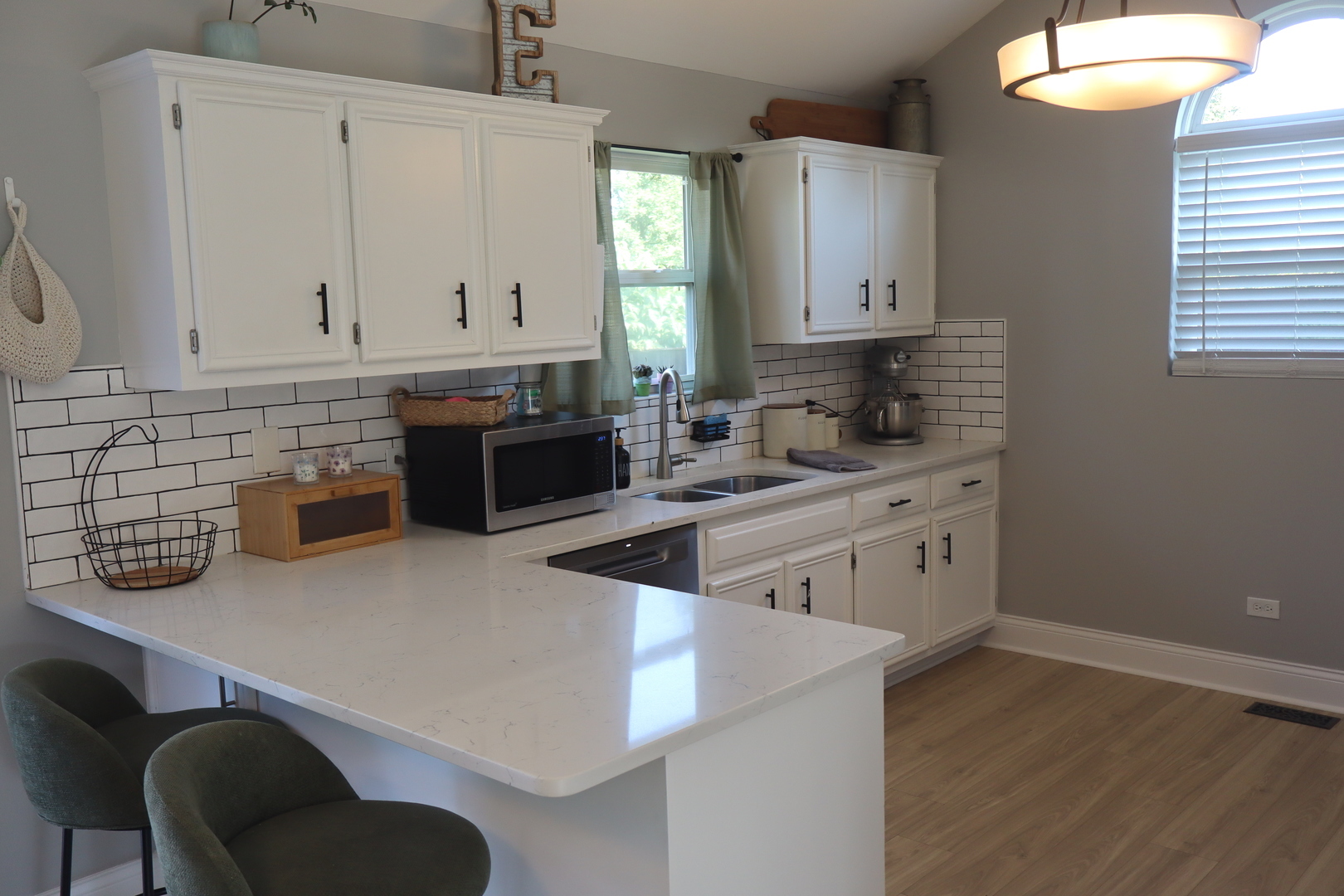 24930 Cashel Bay Road Manhattan, IL 60442 - Photo 10 of 24 a kitchen with stainless steel appliances granite countertop a sink a stove and a wooden cabinets