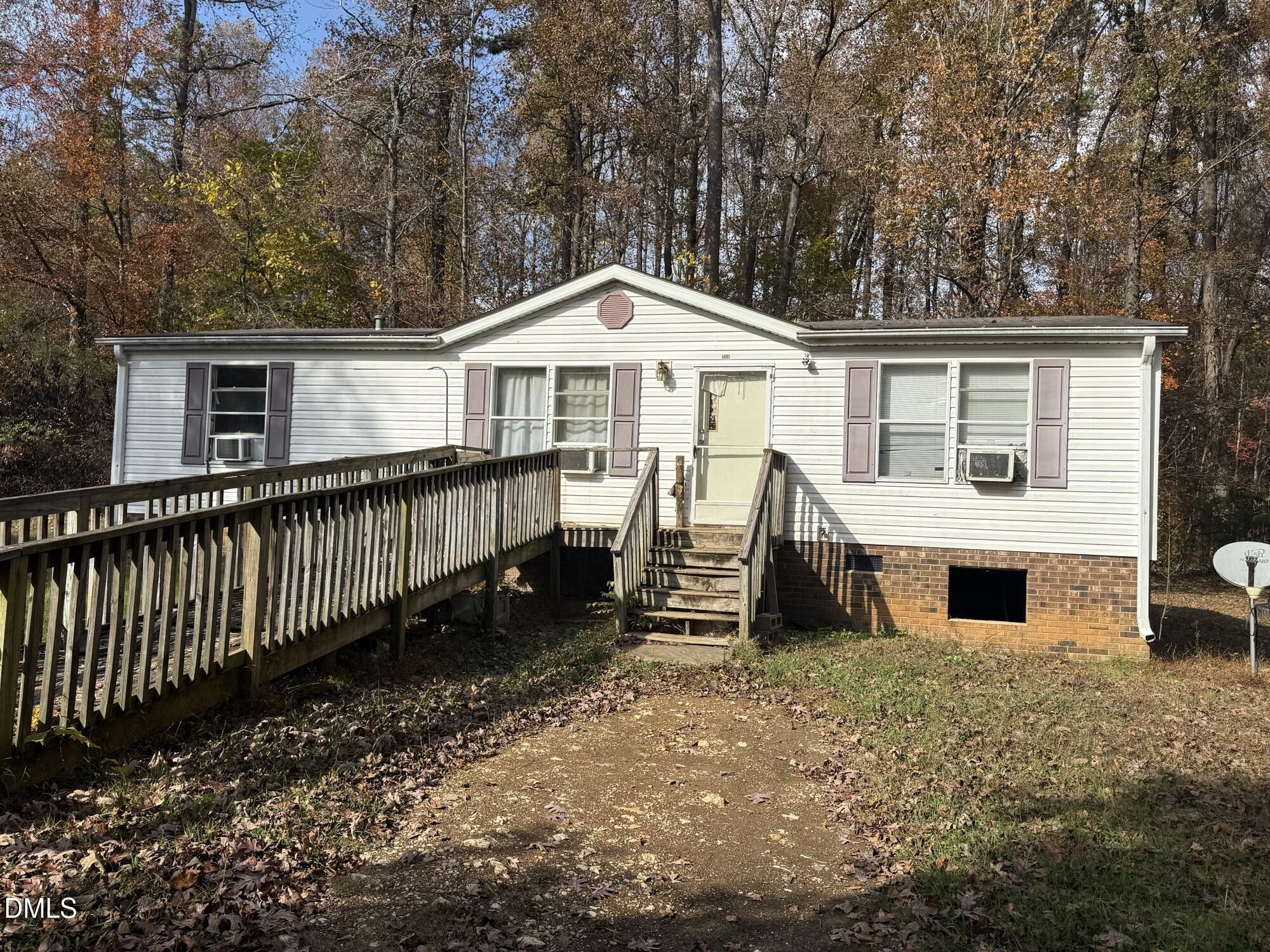 326 Gaines Chapel Road Efland, NC 27243 - Photo 3 of 4 a front view of a house with a yard