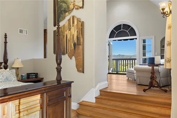 a large kitchen with a large window and stainless steel appliances