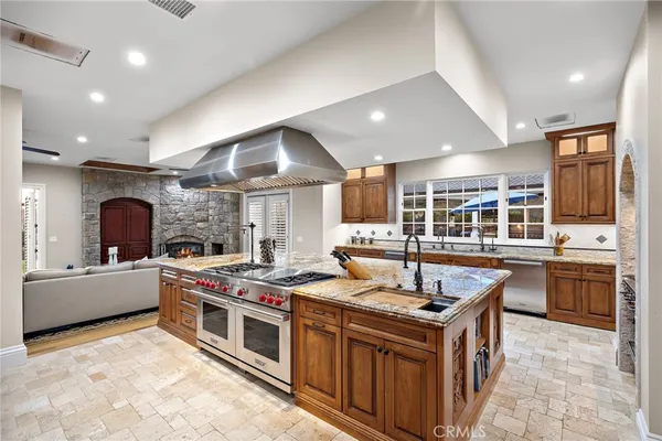 a kitchen with granite countertop a sink and a window