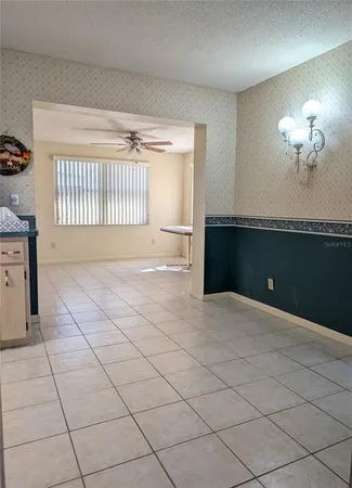 a kitchen with a refrigerator a stove top oven and a refrigerator