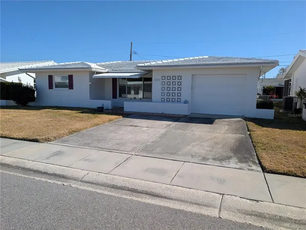 a front view of a house with yard
