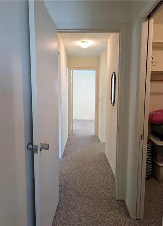 a spacious bedroom with a bed and a dresser