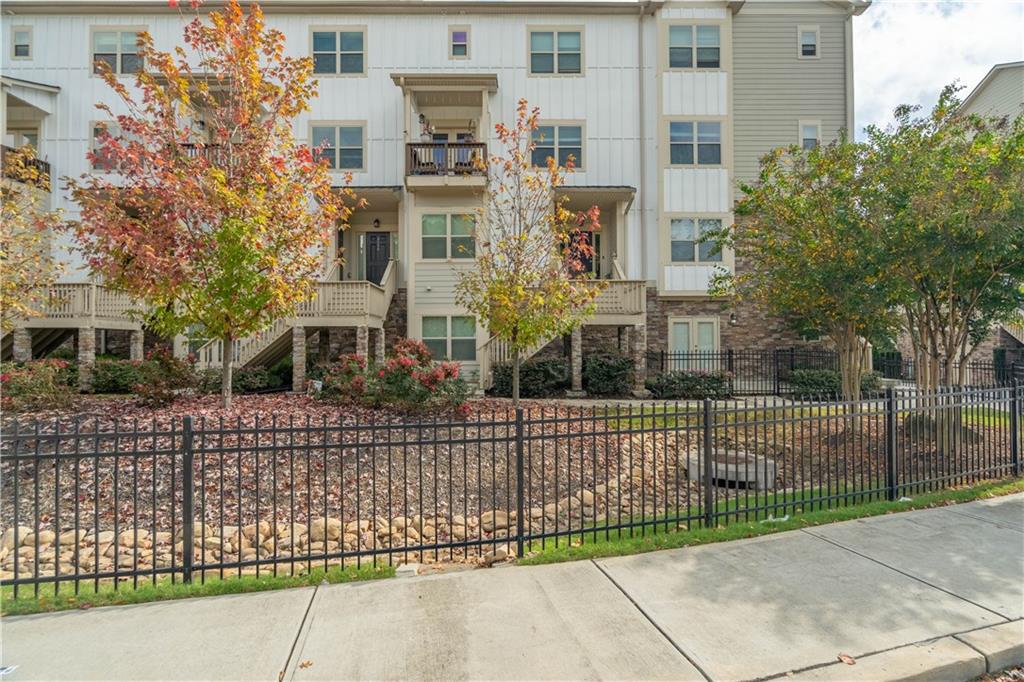 3110 Quantum Lane, Unit 53 Atlanta, GA 30341 - Photo 1 of 38 a view of a brick building next to a yard